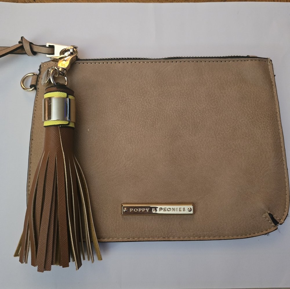Poppy & Peonies clutch or wristlet-style bag. It is made of a vegan leather